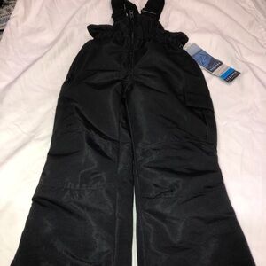 The Iceburg Kids Snow Bibs in black are insulated and waterproof .